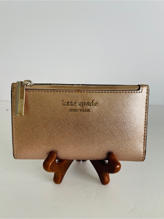 kate spade Handbags - Kate Spade Metallic Rose Gold Saffiano Leather Small Slim Bifold Wallet